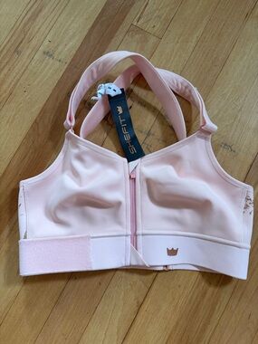 SHEFIT Women’s Front-Zip Sports Bra in Pale Pink